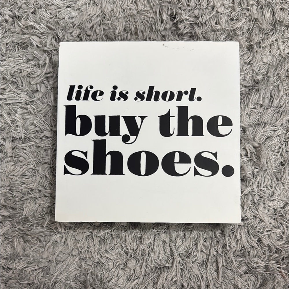 ‘Buy the Shoes’ wall decor